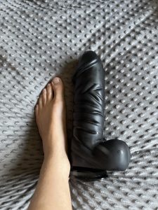 gay Blackmailed and exposed sub charlie barnett showing off a huge dildo with his foot